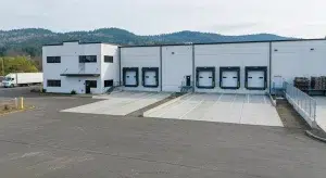 Industrial property sales listing with warehouse loading docks in McMinnville Oregon.